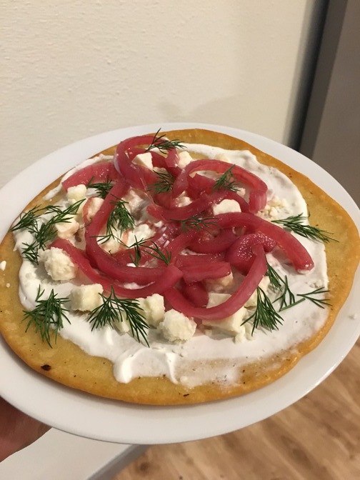 Chickpea pancakes with sour cream, pickled onions, feta, and dill